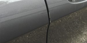 Damaged Car Door Edge Before Protection Treatment