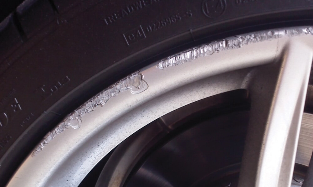 Damaged Car Rim Closeup Before Treatment